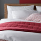 Grid Berry Duvet Cover and Shams on Bed