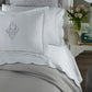 Harmony Scallop Sateen Flat Sheet Mist on a Bed in a Transitional Bedroom