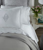 Harmony Scallop Sateen Flat Sheet Mist on a Bed in a Transitional Bedroom