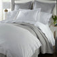 Harmony Scallop Sateen Flat Sheet Mist on a Bed in a Transitional Bedroom