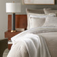 Honeycomb Reversible Duvet Cover and Shams on Bed in Hotel Room Linen