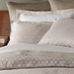 Honeycomb Reversible Duvet Cover and Shams on Bed in Hotel Room Linen