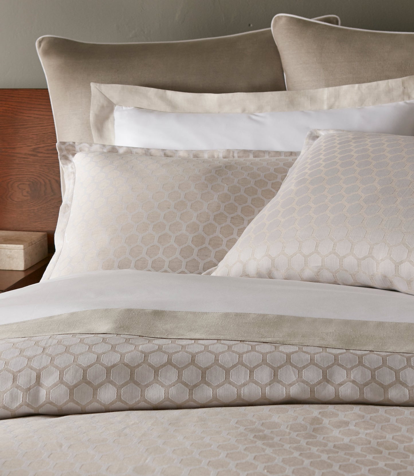 Honeycomb Reversible Duvet Cover and Shams on Bed in Hotel Room Linen