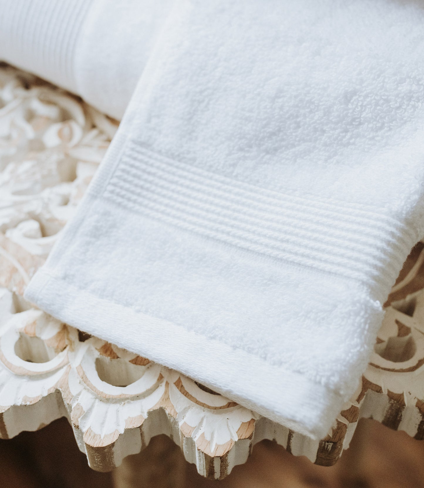 Liam Hand Towel In White On A White Table