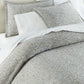 Ravenna Jacquard Sham on bed Pine