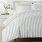 ribbon stripe percale Olive duvet cover on a bed in bedroom