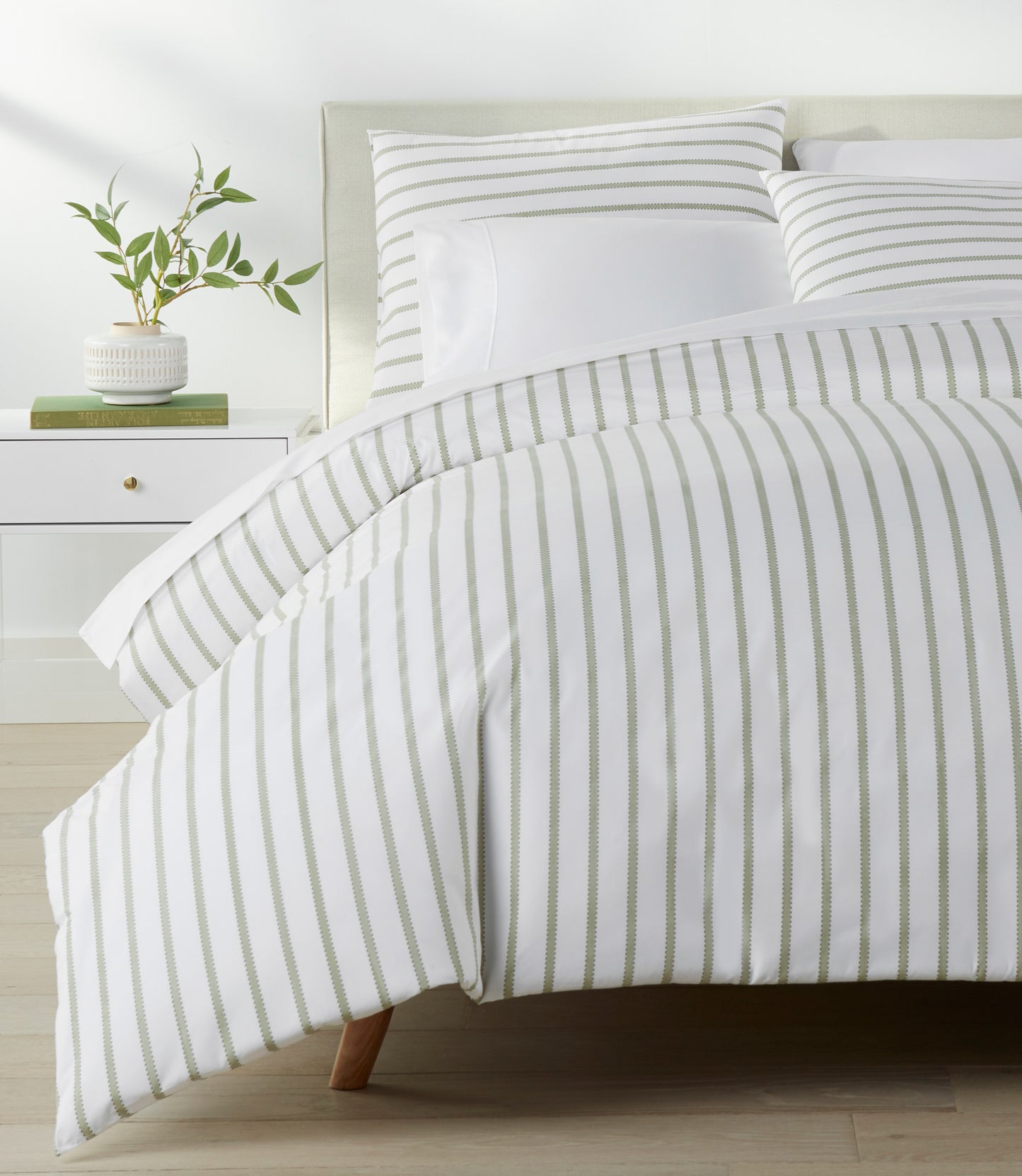 ribbon stripe percale Olive duvet cover on a bed in bedroom