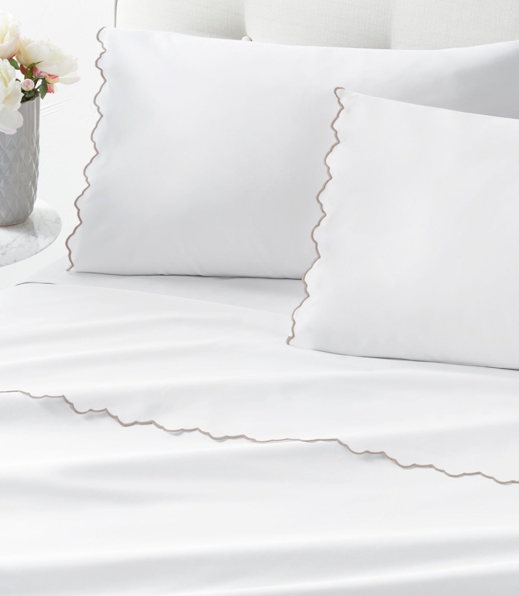 Urban Scallop Sheet Set on bed Taupe