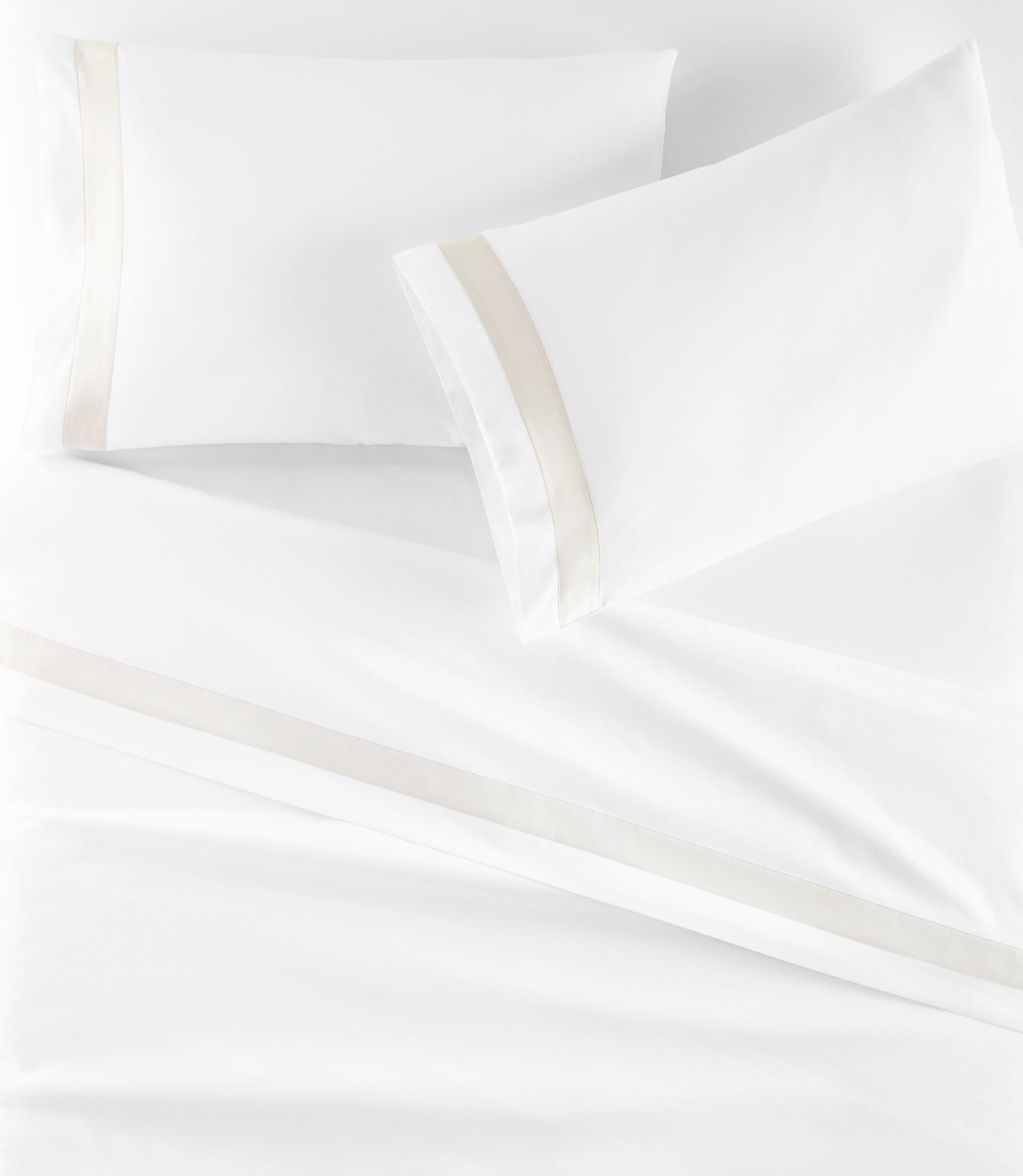 Soprano Trim Sateen Pillowcases on bed Platinum