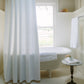 Vienna Matelassé Shower Curtain White Hanging In Bathroom Next To End Table