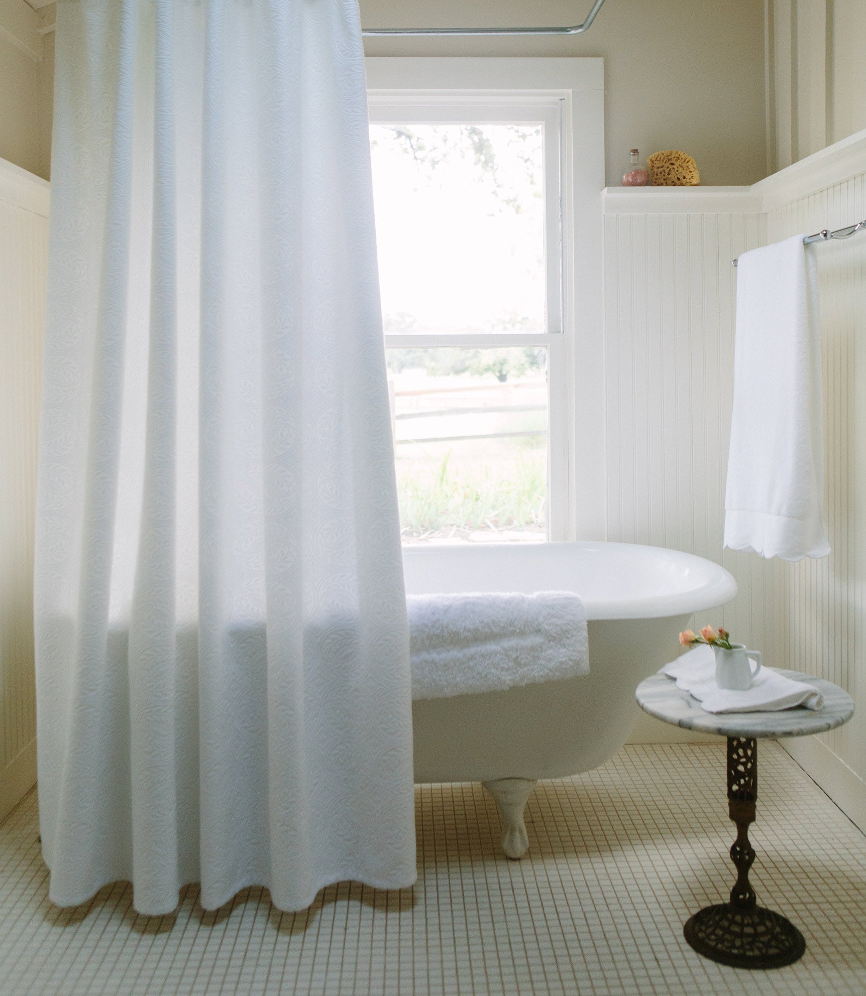 Vienna Matelassé Shower Curtain White Hanging In Bathroom Next To End Table
