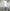 Vienna Matelassé Shower Curtain White Hanging In Bathroom Next To End Table - Secondary Image
