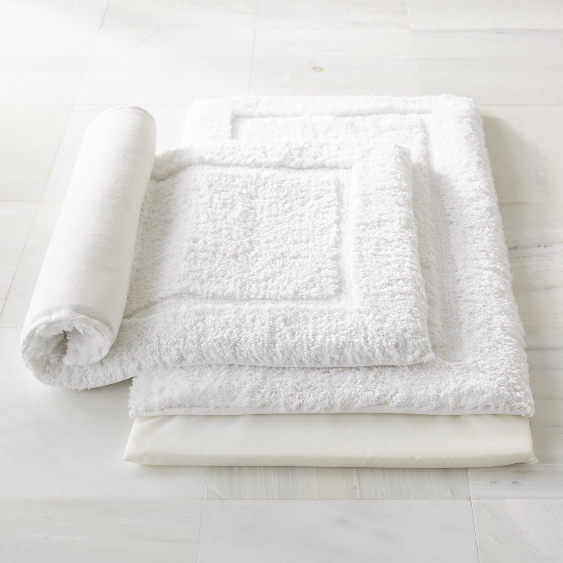 two white memory foam cotton bath rugs